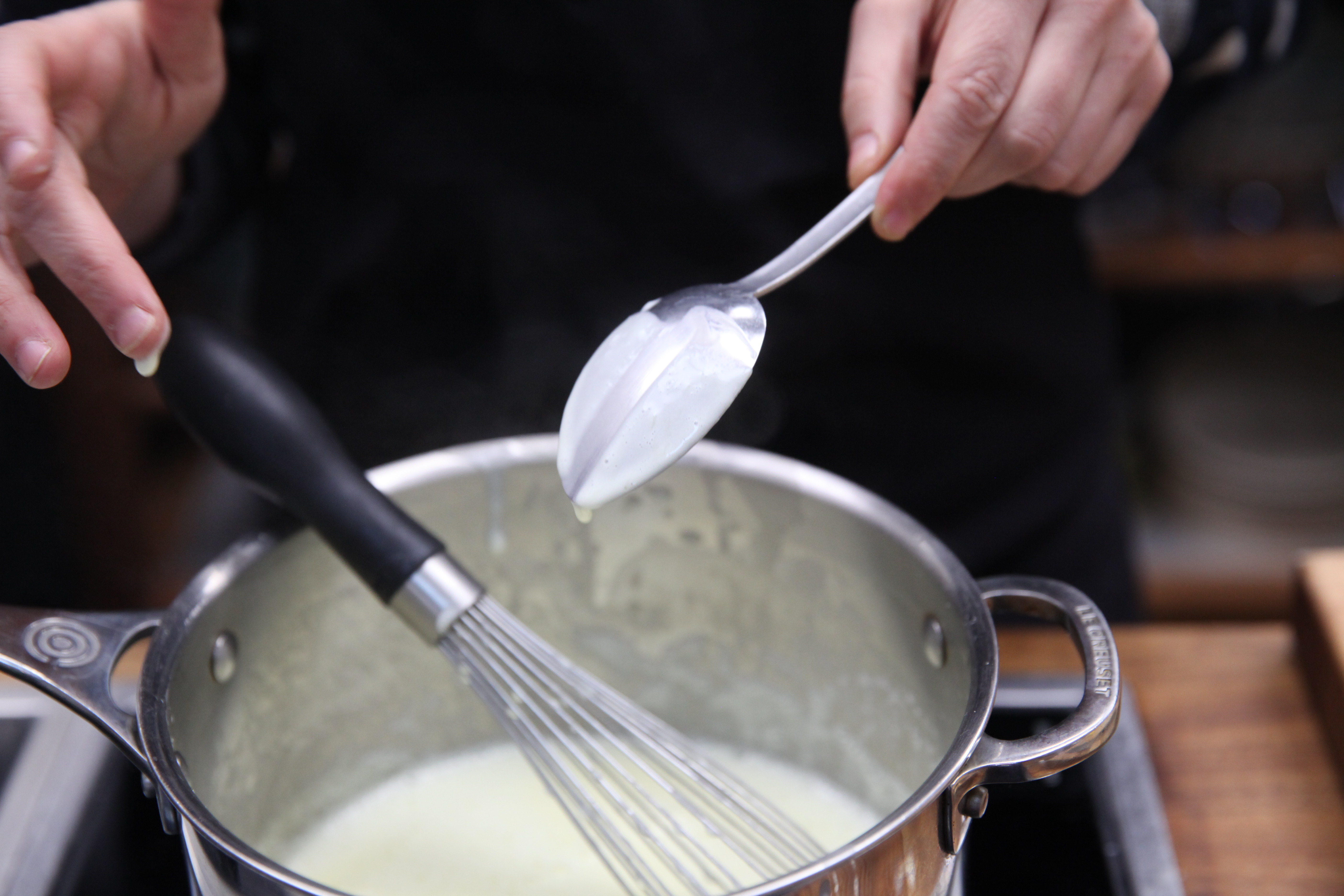 pot of thickened milk for mango and corn pudding