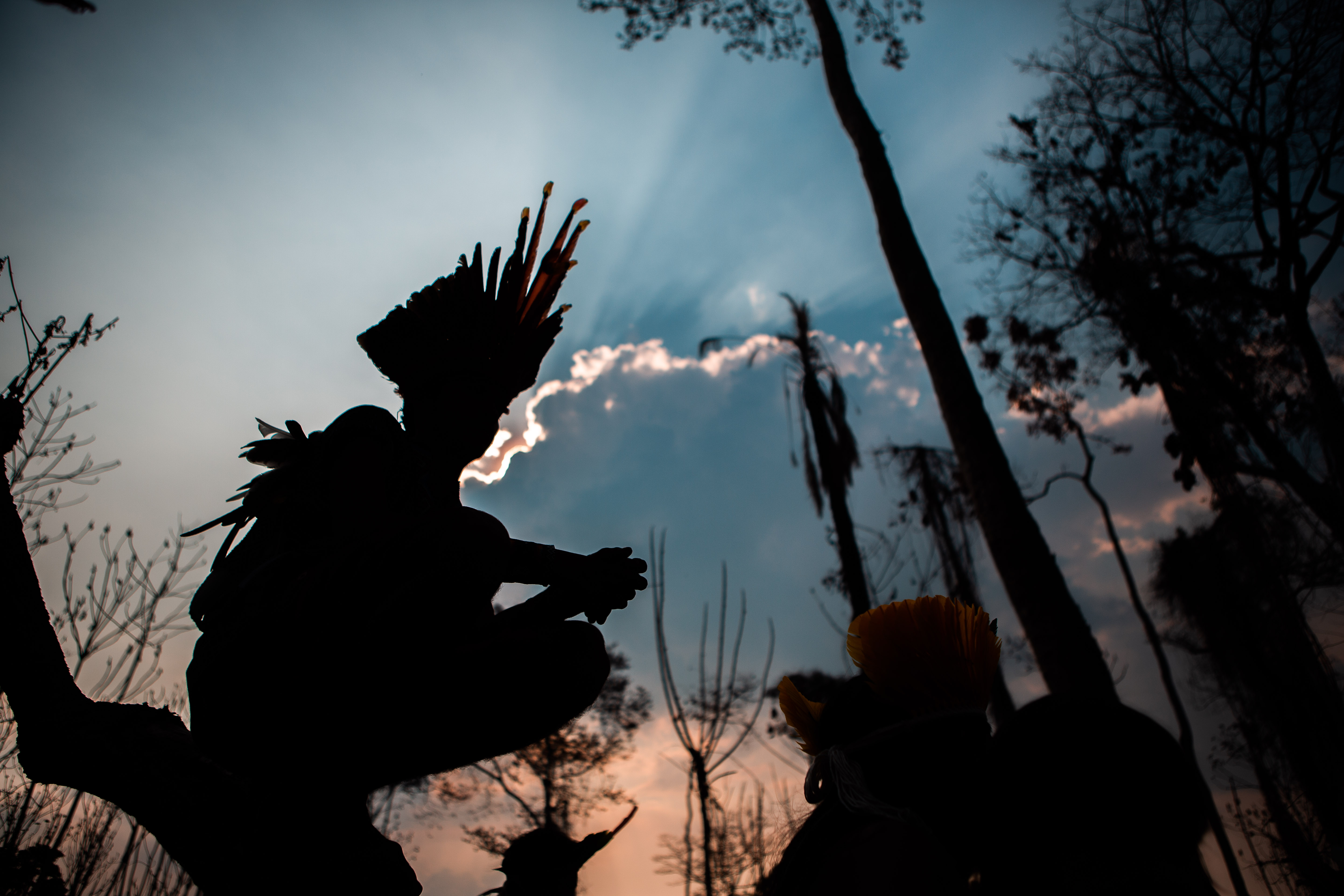 Outline of indigenous man against the sky