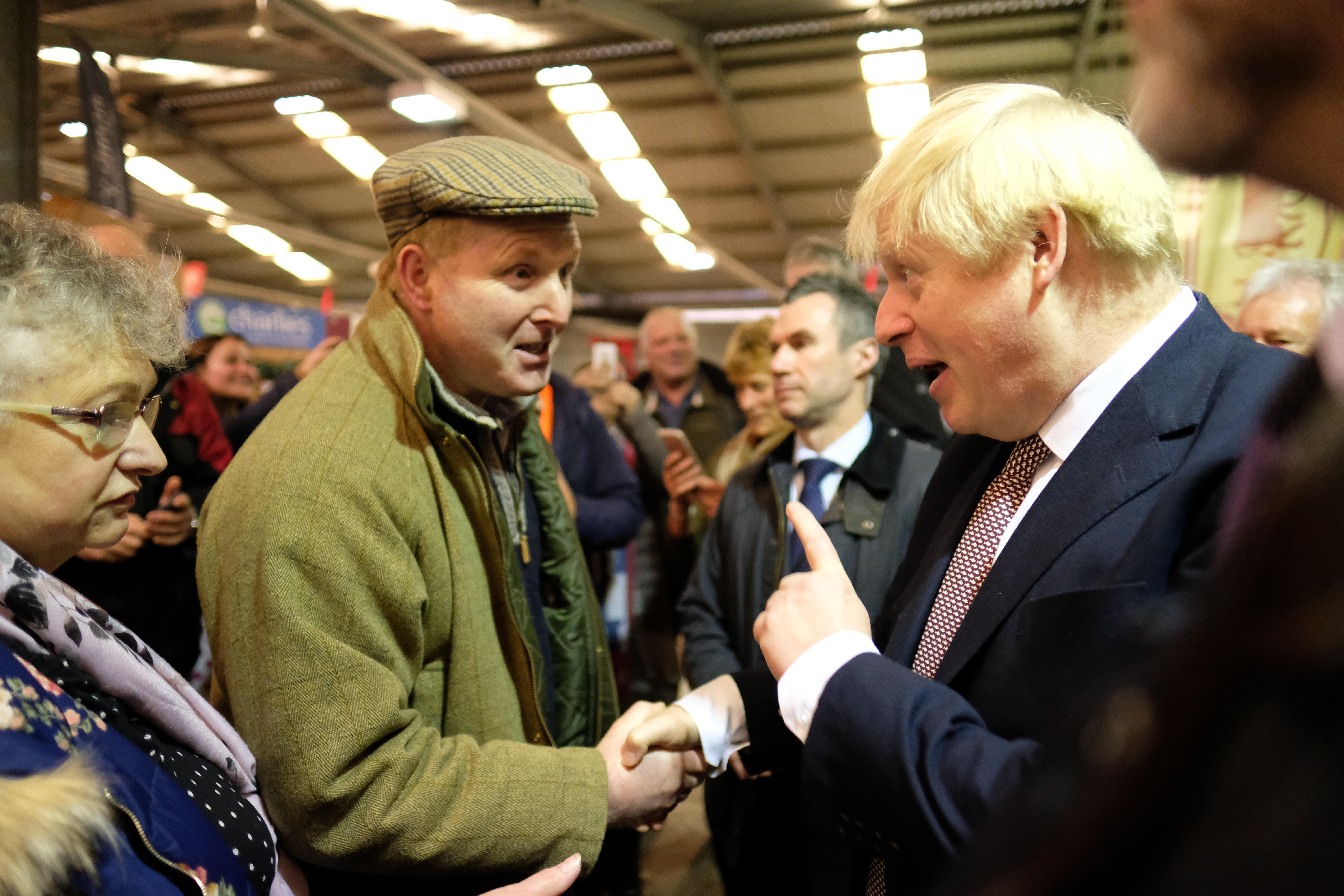 Boris Johnson shaking hands with someone in Builth Wells