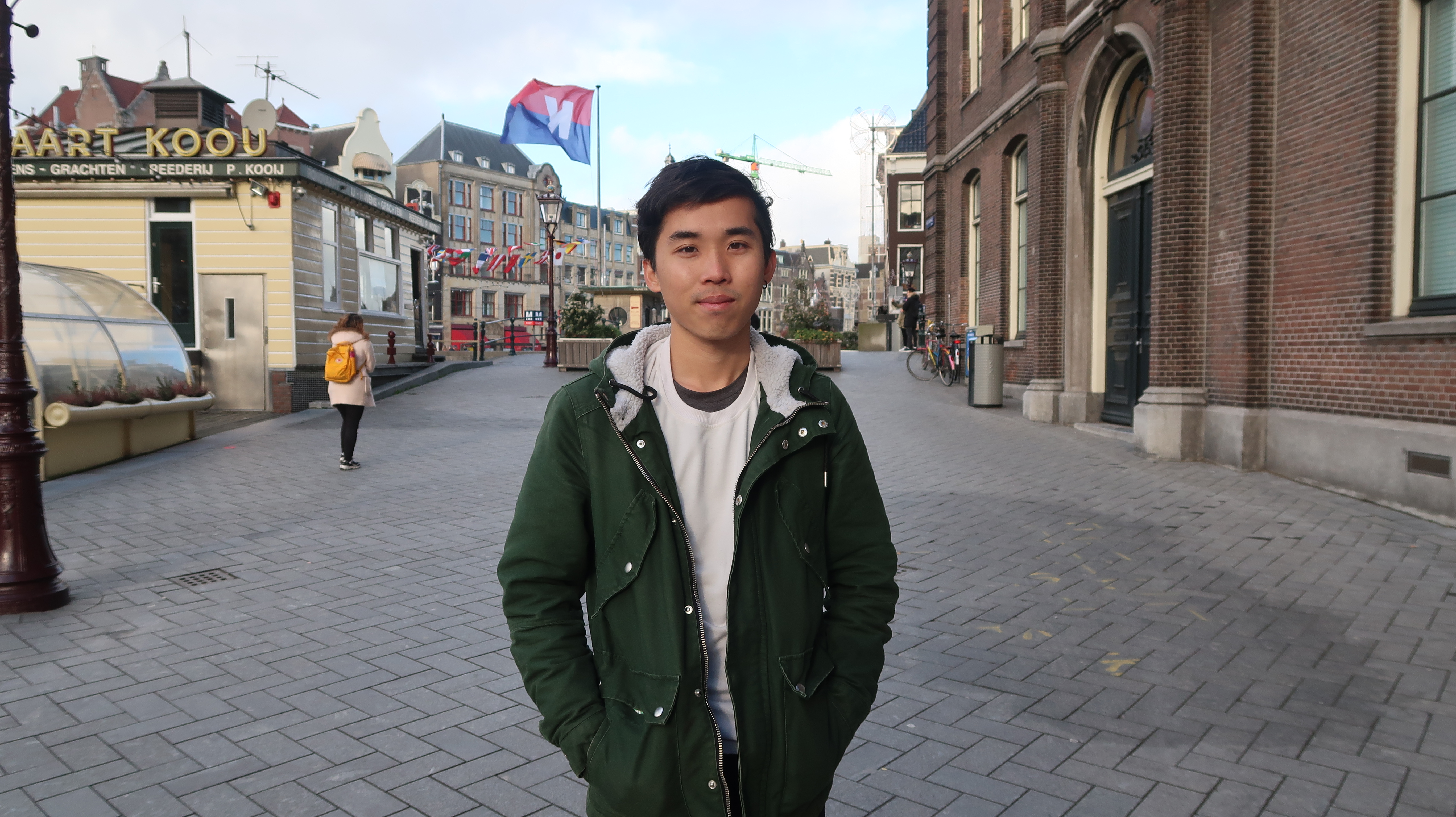 A photo of a young man on the streets of the Netherlands.