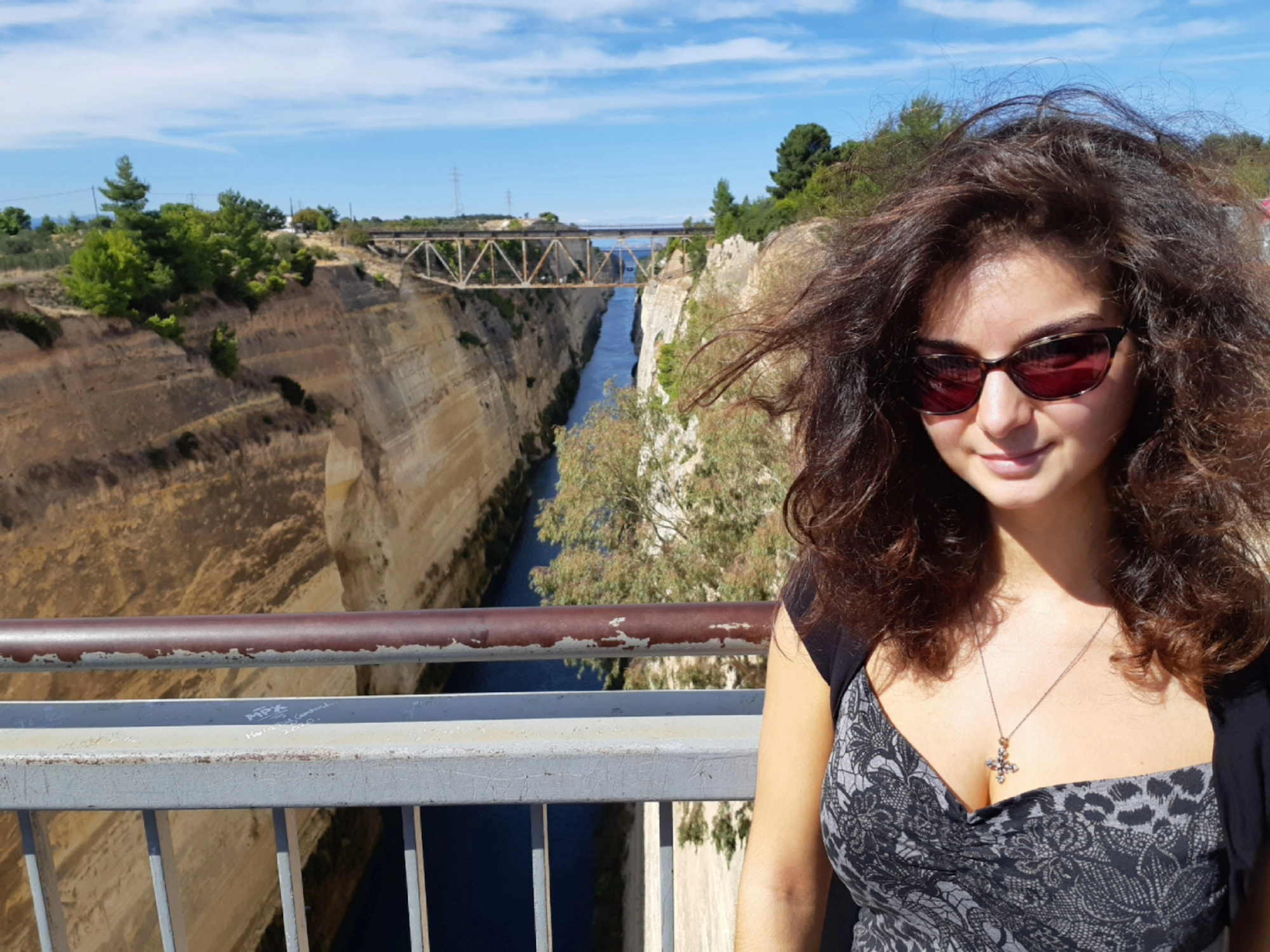 A photo of Marianne on a bridge in Greece.