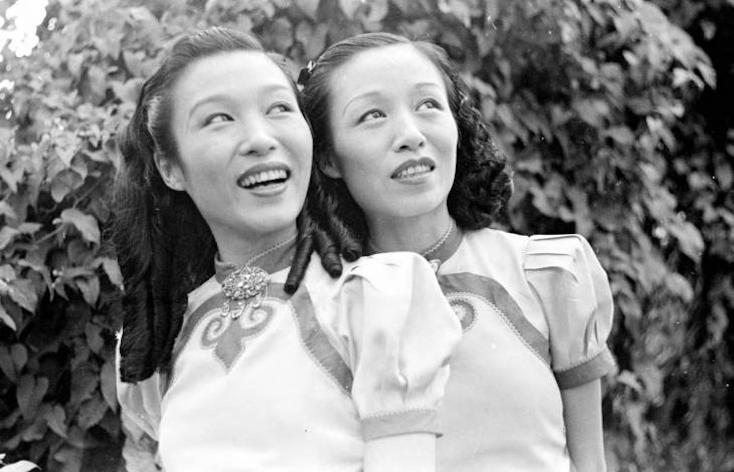 two smiling women in 1940s singapore
