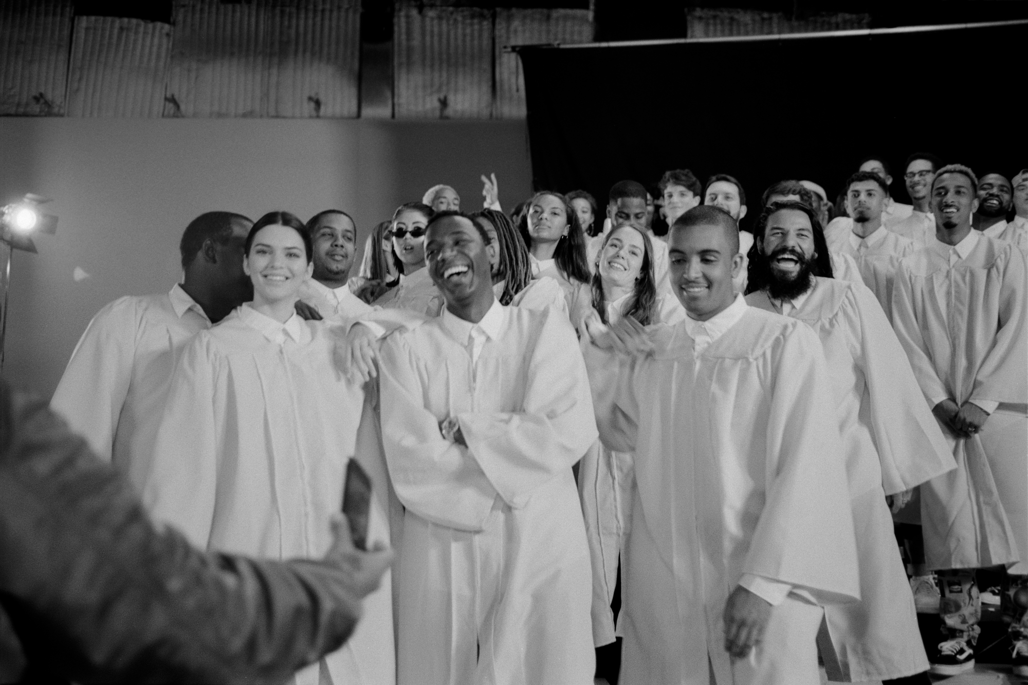 A group of people wearing church robes laughing.