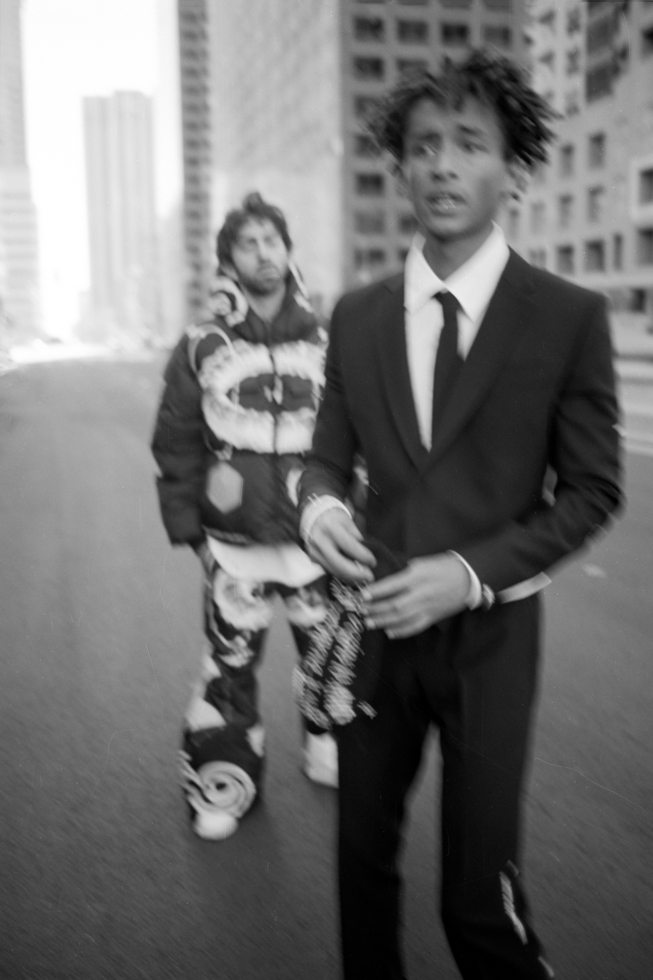 A photo of Mateo Arias and Jaden Smith in the middle of the street.