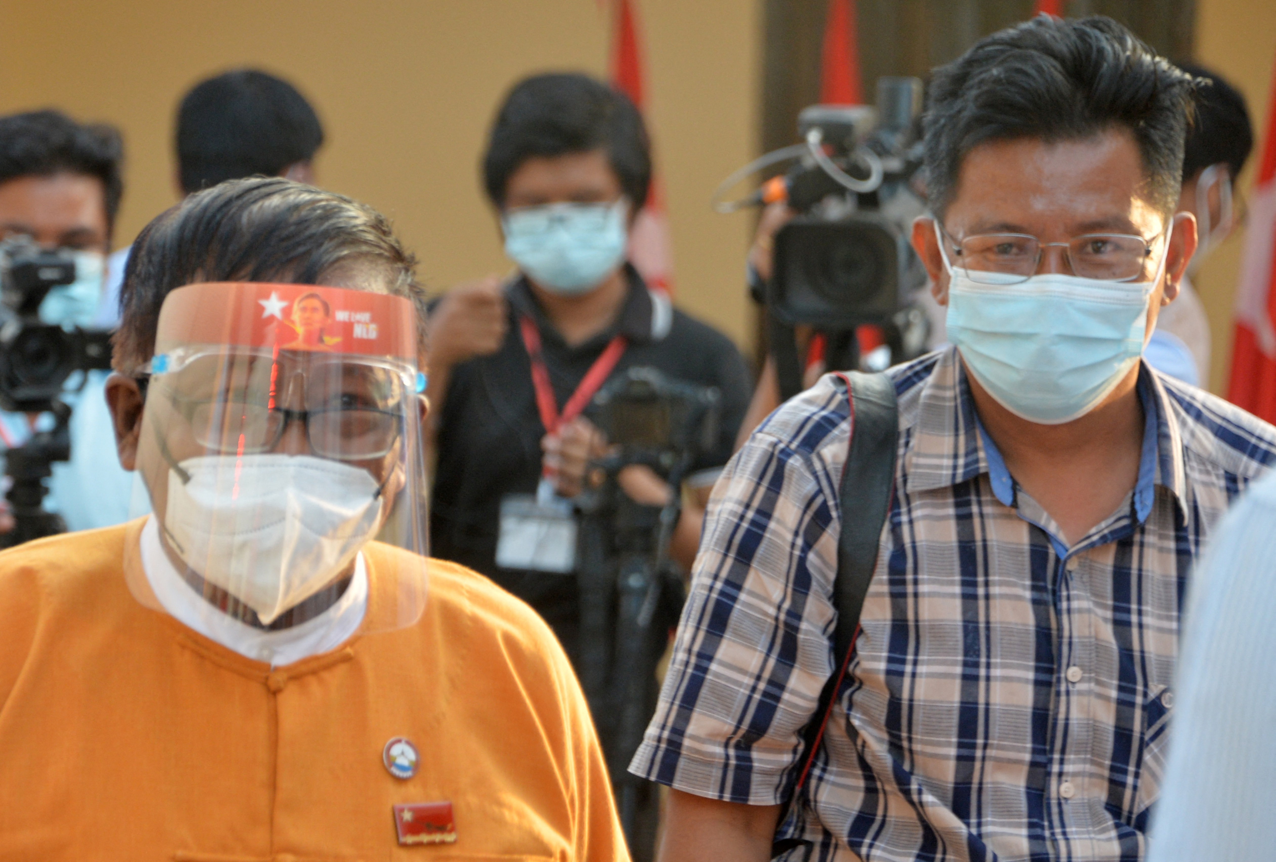 BBC Burmese journalist Aung Thura (right) leaves after a press briefing in Naypyidaw. PHOTO: AFP