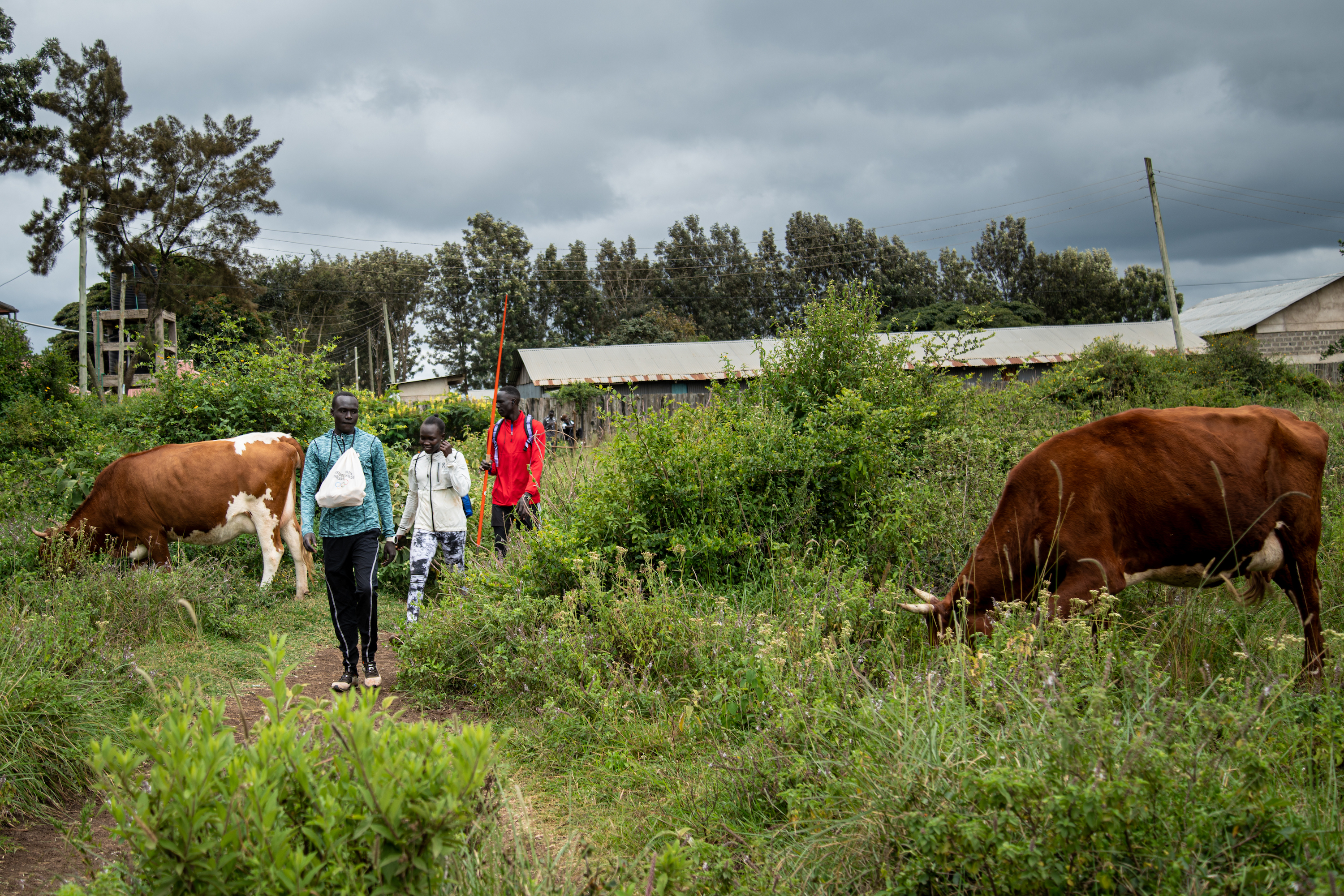(From left) Athletes Dominic Lokolong Atiol, Rose Nathike Lokonyen, and Ayella Solomon Okeny at the training base in the hills of Ngong. Photo: Leonardo Mangia