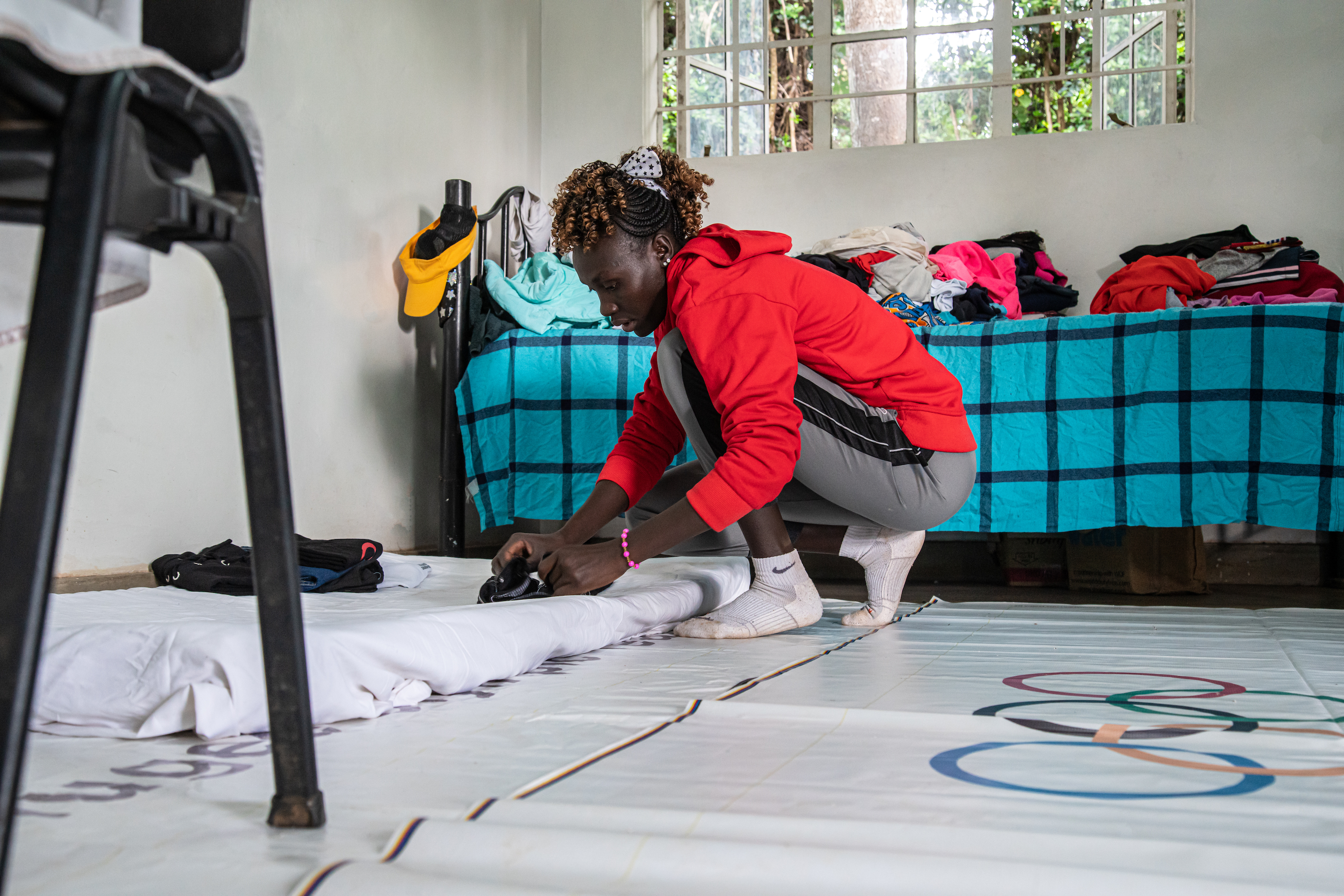 Anjelina, in her room in Ngong, packs up before leaving for the Refugees Olympic Team’s training camp in Doha, from where she’ll go to Tokyo.&nbsp;Photo: Leonardo Mangia