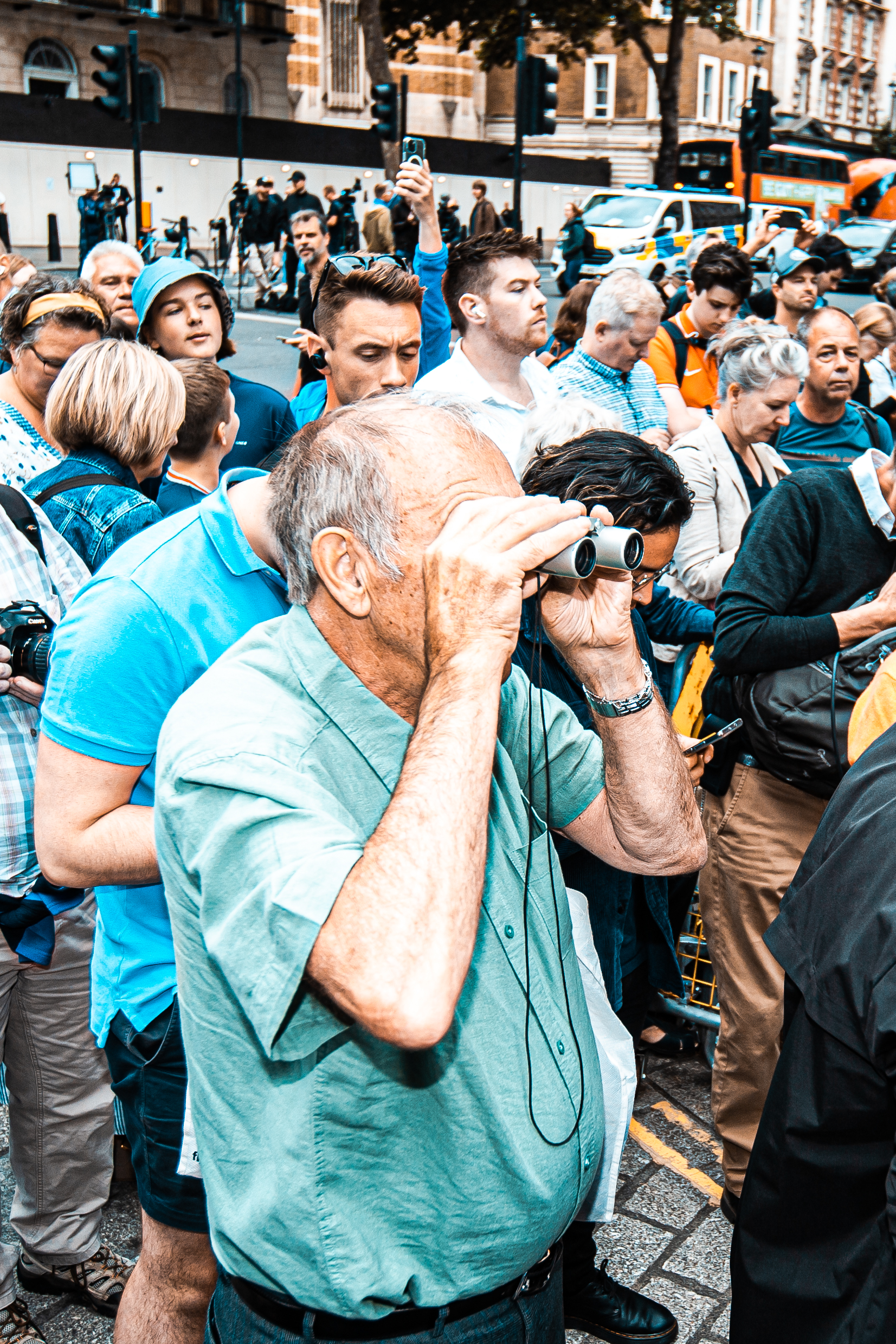 Downing Street, London: An old man tries to use binoculars to see inside Number 10