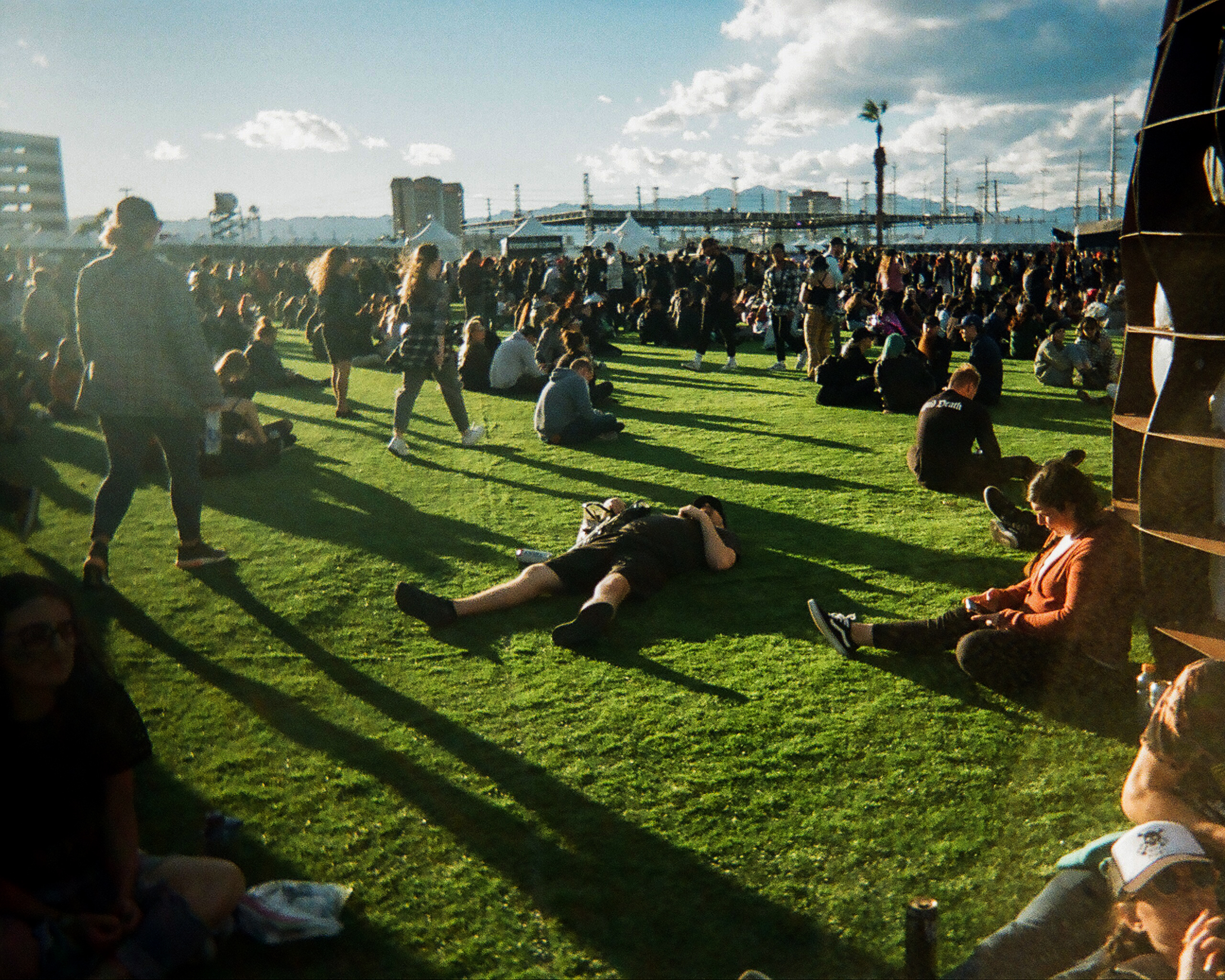 Attendee at festival taking a nap on grass floor