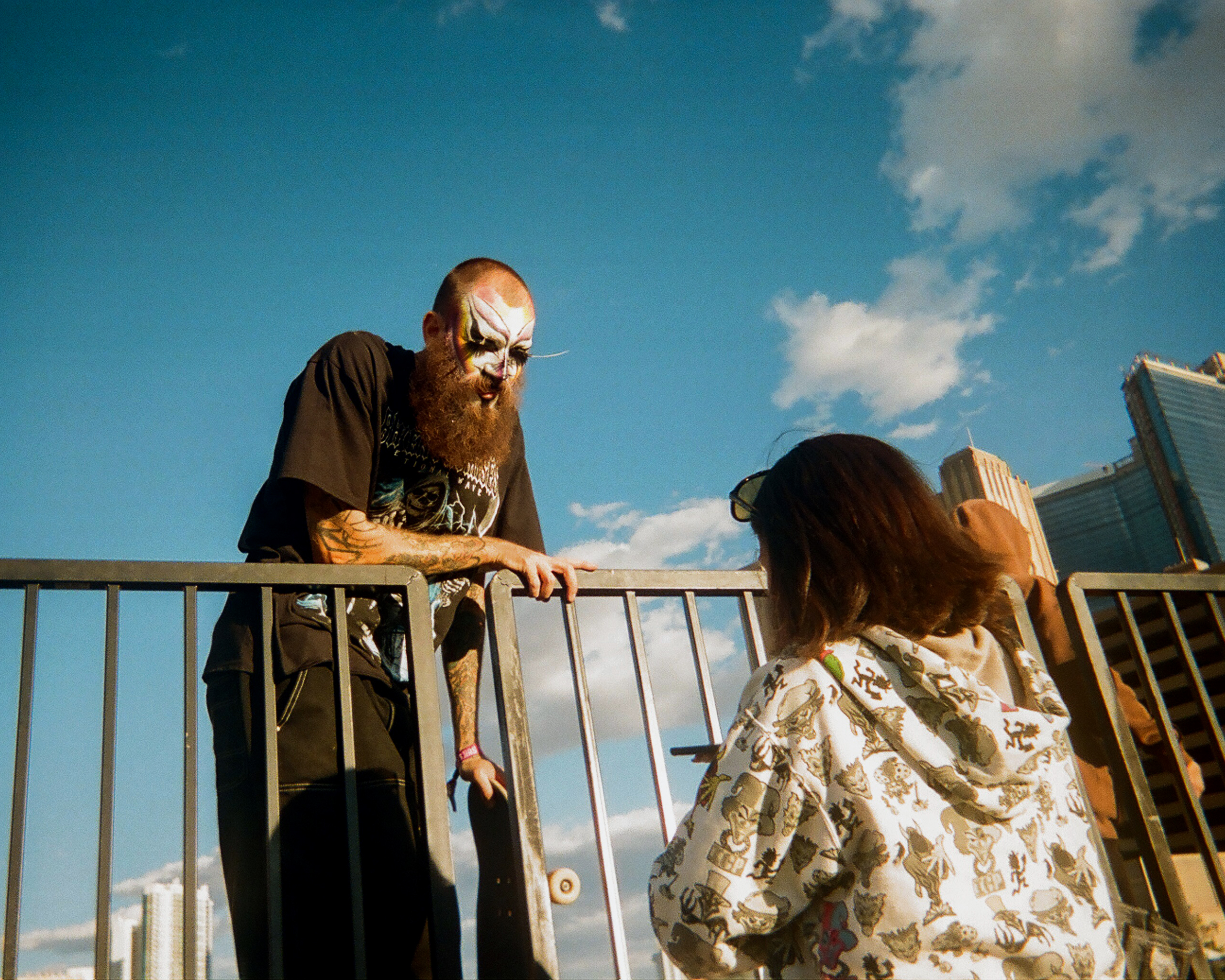 Skateboarder in heavy makeup at festival